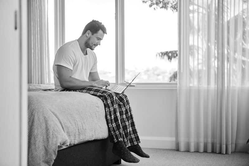 CISO working securely in the Microsoft cloud, from a laptop on his bed